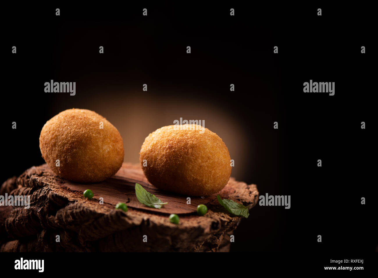 Arancini italian rice balls which are coated with bread crumbs and