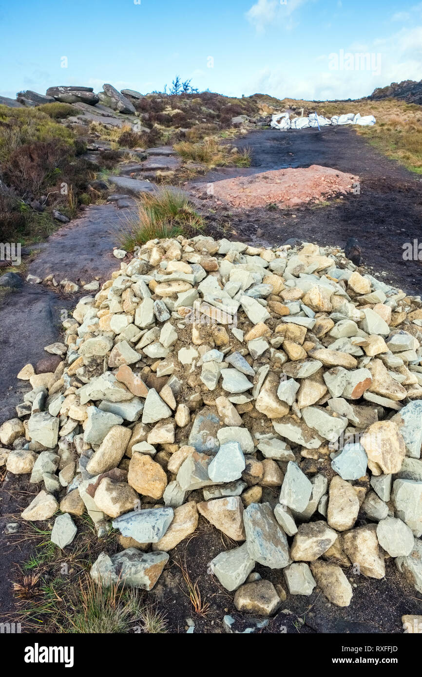 Pile of stones ready to be used for footpath restoration on the Roaches,  Peak District National Park, UK Stock Photo