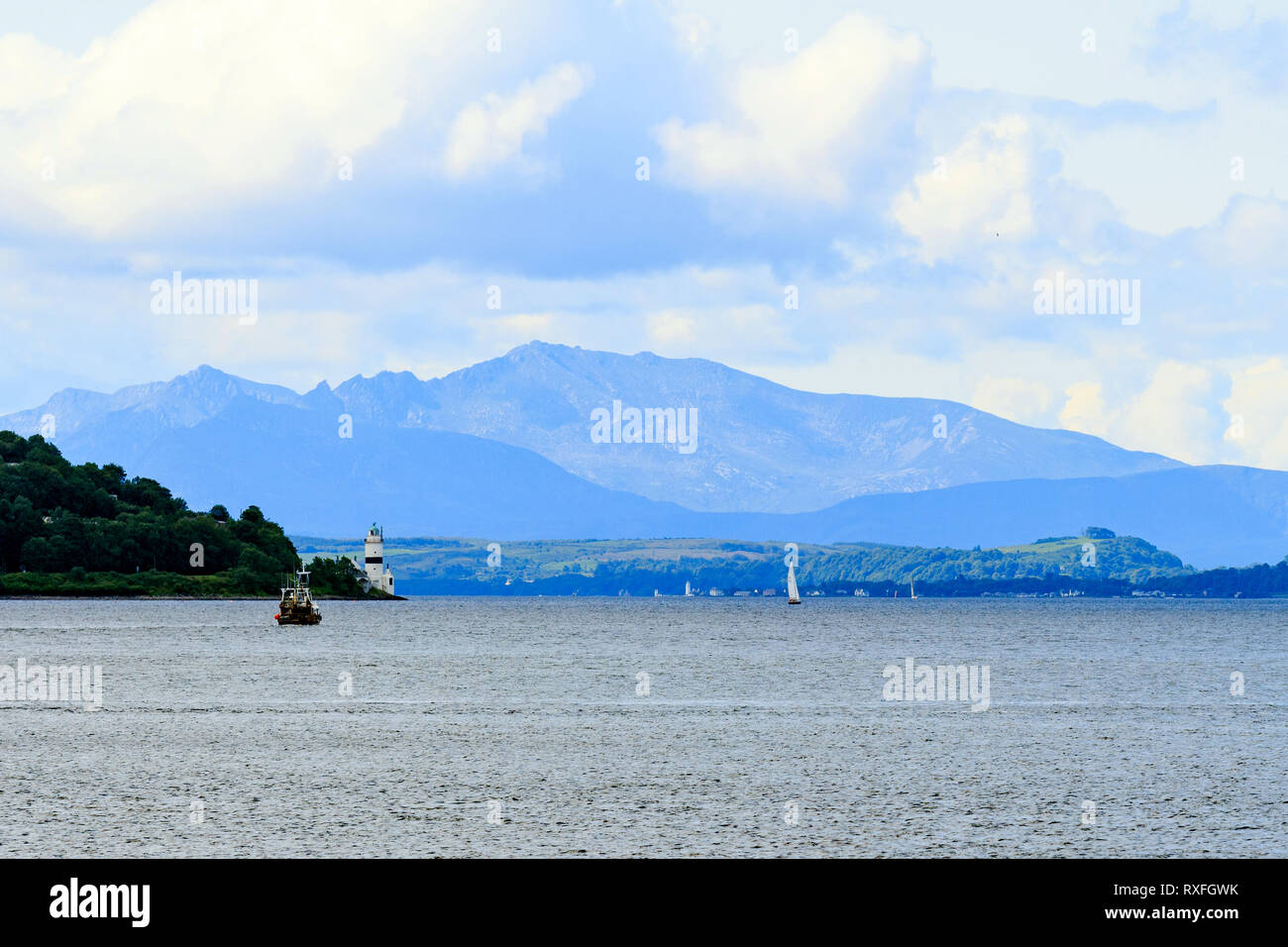 View over Scottish Loch with light mist cover distant hills Stock Photo