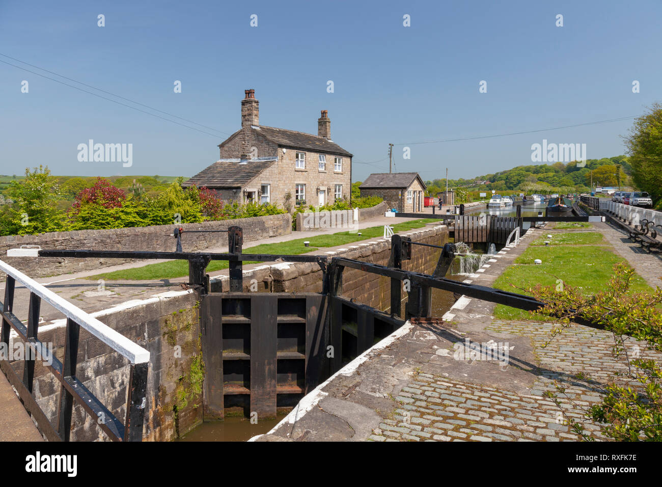 The lock gates and lock keepers cottage on the Leeds Liverpool canal at Wheelton Lancashire Stock Photo