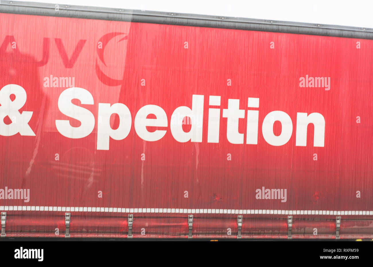 the inscription on a red trailer truck Stock Photo