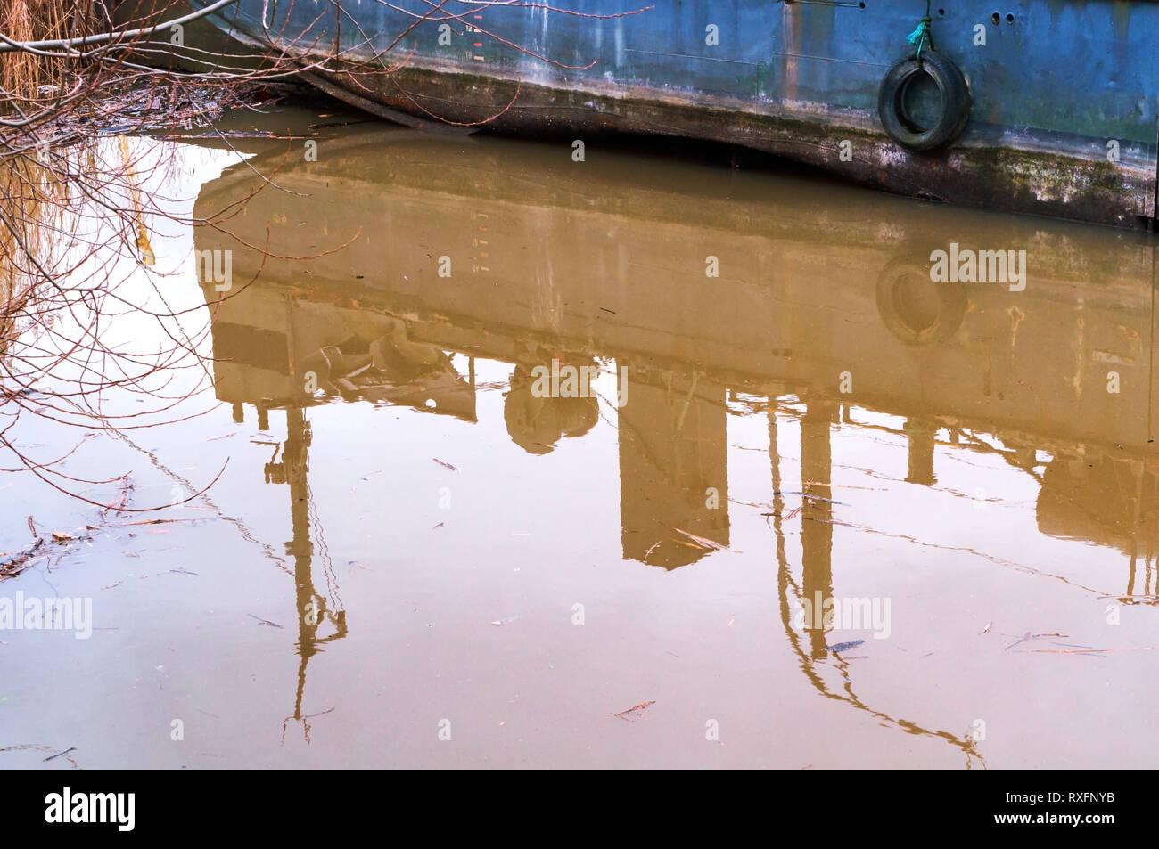 ship reflection in water, blue ship and its reflection Stock Photo