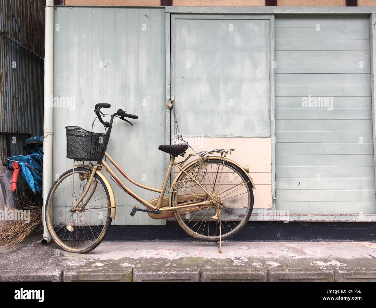 Toyohama, Japan - December 12, 2016: Bike chained to a house in a small japanese island called Toyohama in Hiroshima, Japan Stock Photo