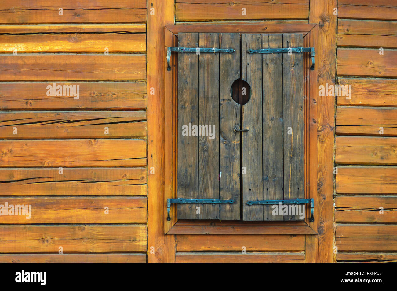 Log Wall Texture With Closed Wooden Window Shutters Log House