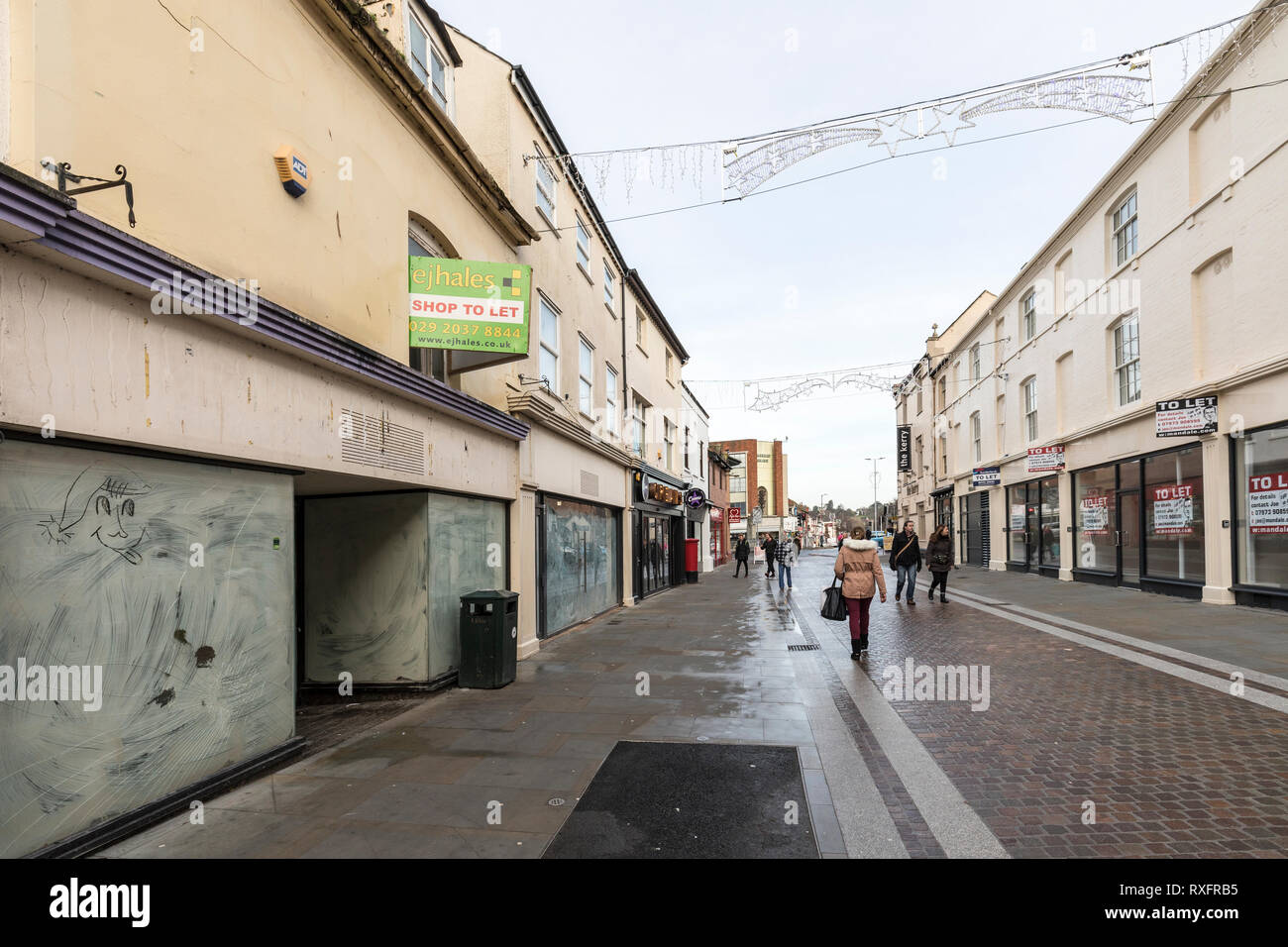 Closed shops with to let signs and broken windows, Hereford, UK Stock Photo