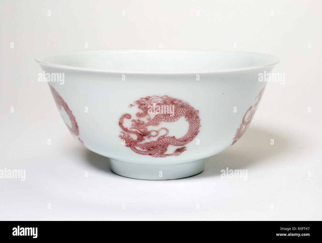 Bowl with Six Dragon Medallions. China. Date: 1662-1722. Dimensions: H. 7.0 cm (2 3/4 in.); diam. 14.9 cm (5 7/8 in.). Porcelain painted in underglaze copper red. Origin: China. Museum: The Chicago Art Institute. Stock Photo