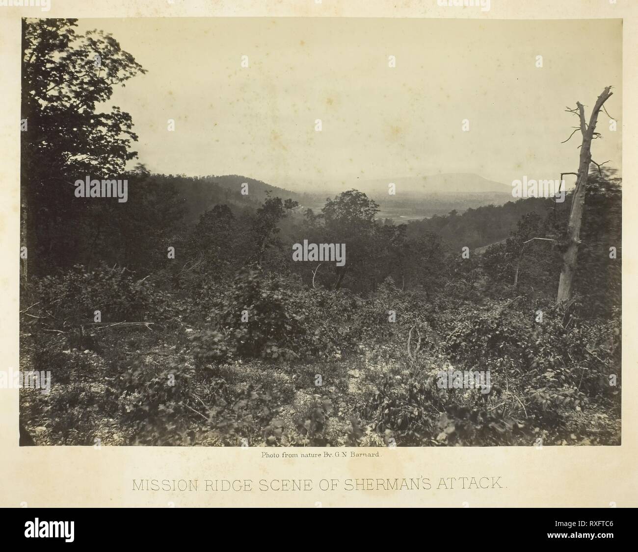 Mission Ridge Scene of Sherman's Attack. George N. Barnard; American, 1819-1902. Date: 1864-1866. Dimensions: 25.6 x 36 cm (image/paper); 40.9 x 50.8 cm (album page). Albumen print, plate 12 from the album 'Photographic Views of the Sherman Campaign' (1866). Origin: United States. Museum: The Chicago Art Institute. Stock Photo