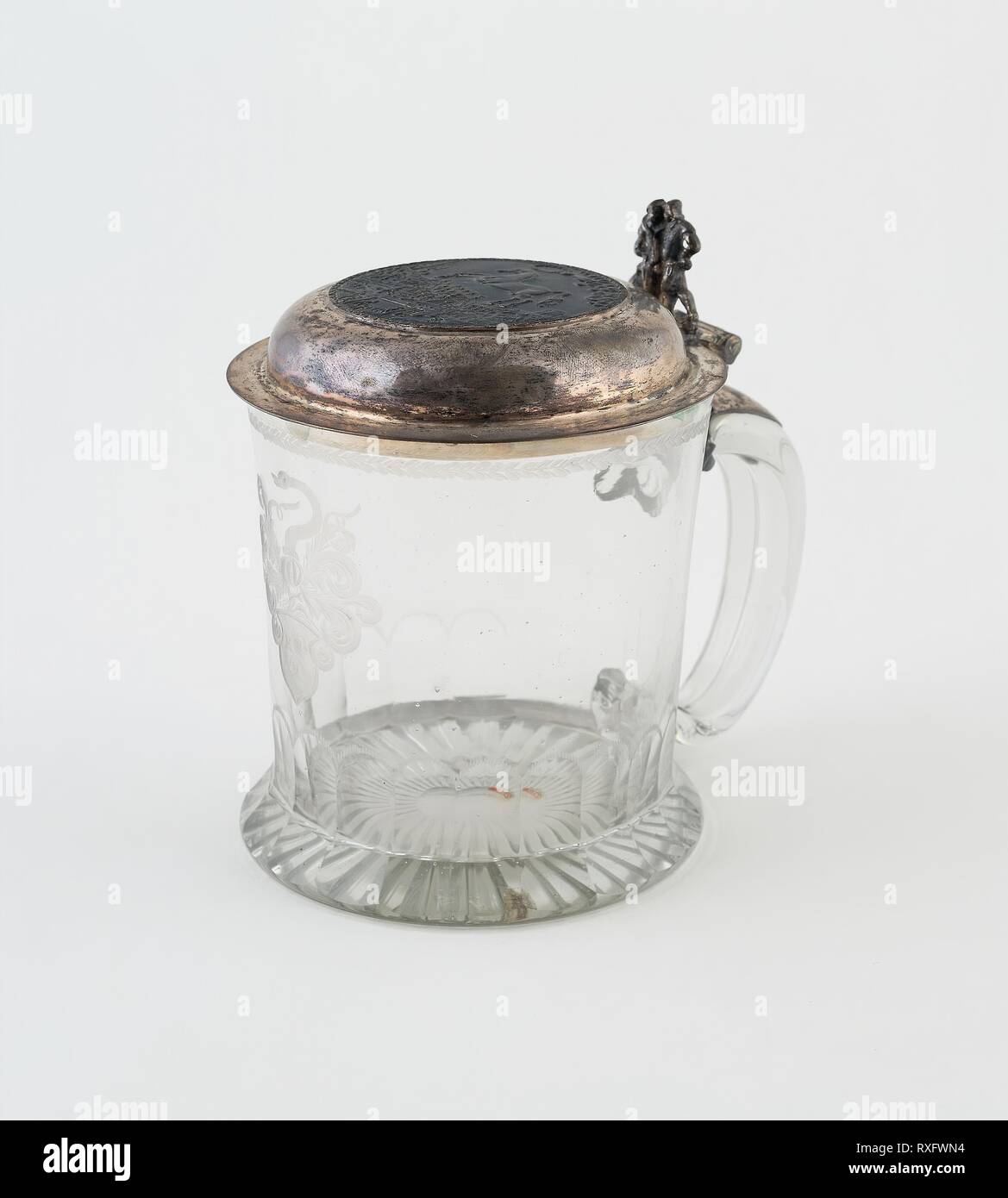 Tankard. Germany. Date: 1725-1735. Dimensions: 14 x 10.3 cm (5 1/2 x 4 1/16 in.). Glass with silver cover. Origin: Germany. Museum: The Chicago Art Institute. Stock Photo