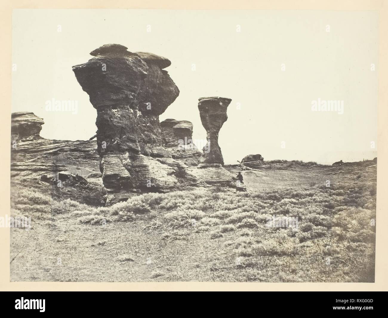 Dial Rock, Red Buttes, Laramie Plains. Andrew J. Russell; American, 1830-1902. Date: 1968-1969. Dimensions: 15.3 x 20.4 cm (image/paper); 23.3 x 30.4 cm (album page). Albumen print, pl. V from the album 'Sun Pictures of Rocky Mountain Scenery' (1870). Origin: United States. Museum: The Chicago Art Institute. Author: Andrew Joseph Russell. Stock Photo