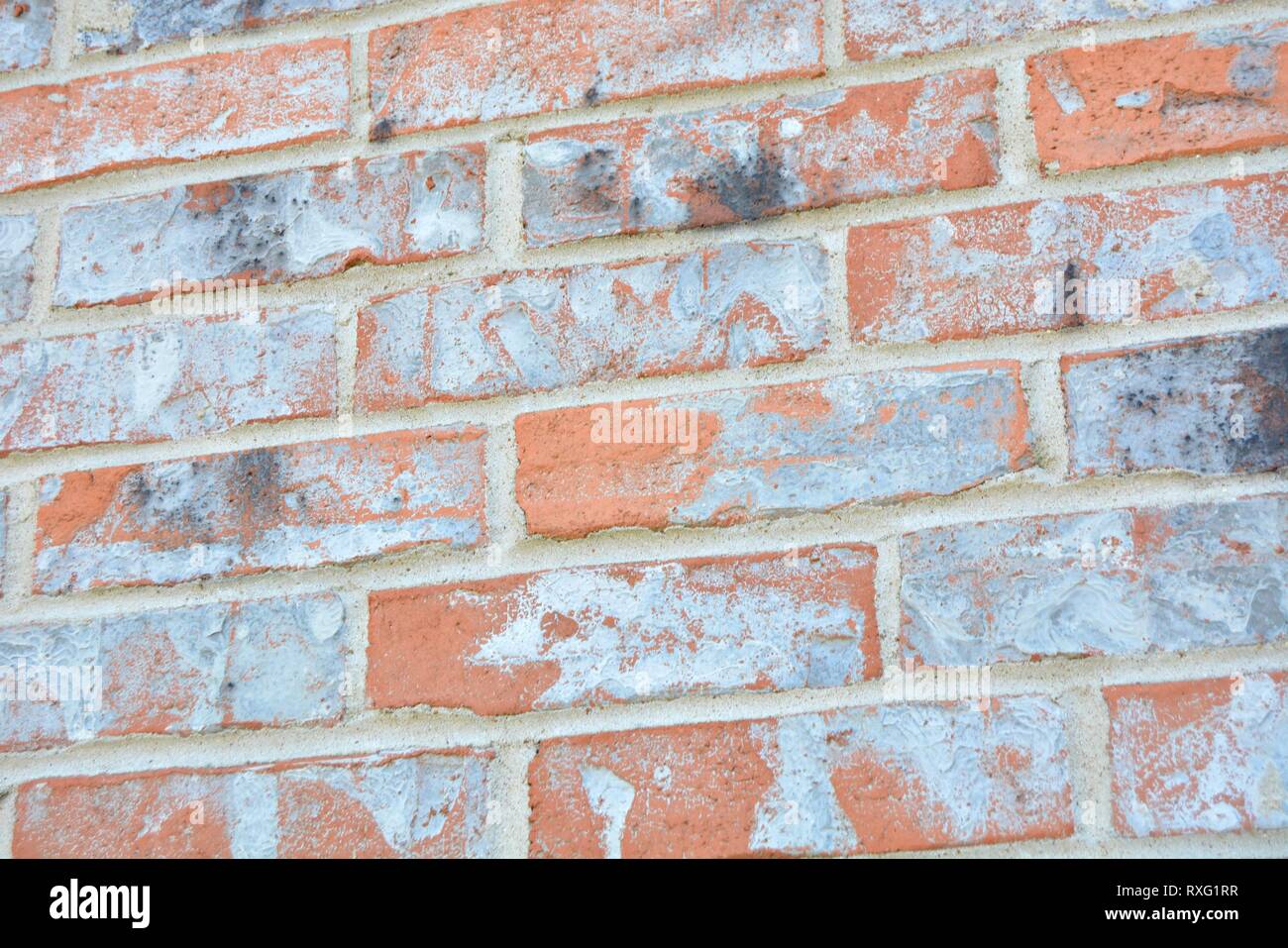 red, orange, grey, white, and black brick background wall Stock Photo