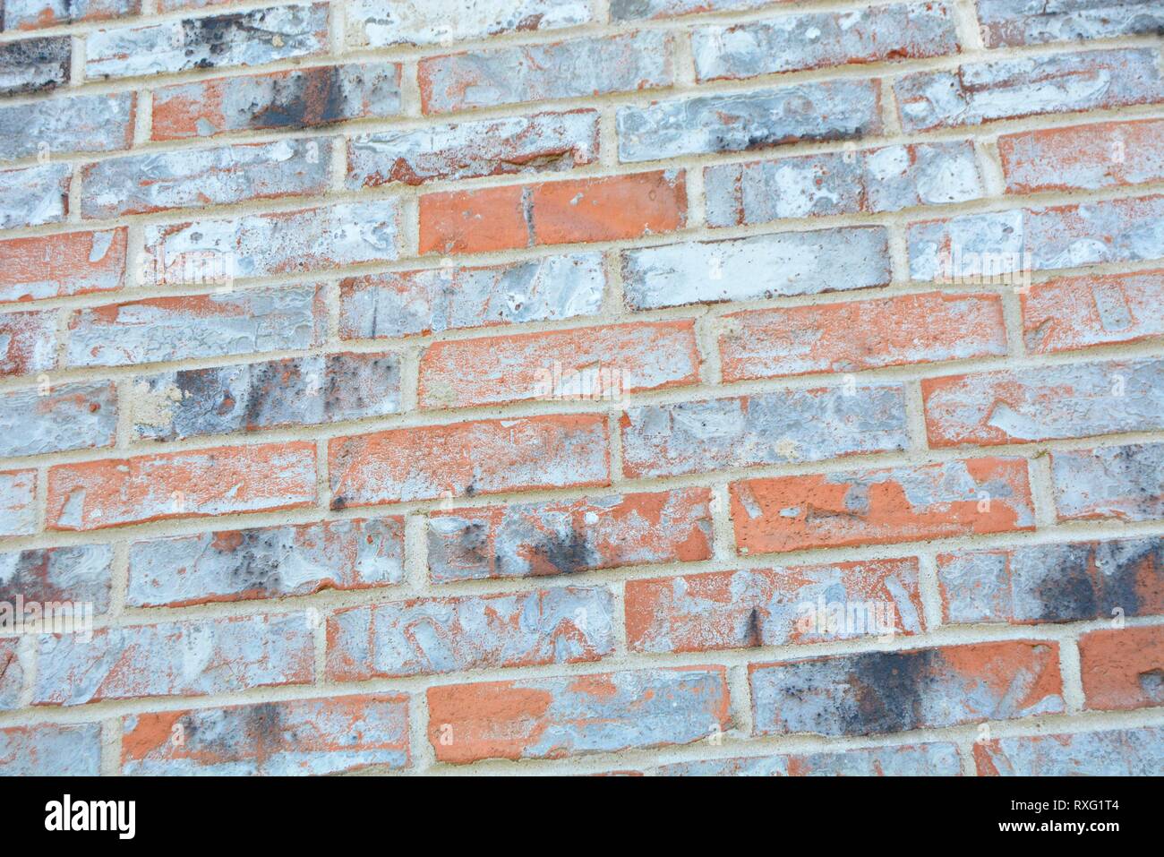 red, orange, grey, white, and black brick background wall Stock Photo