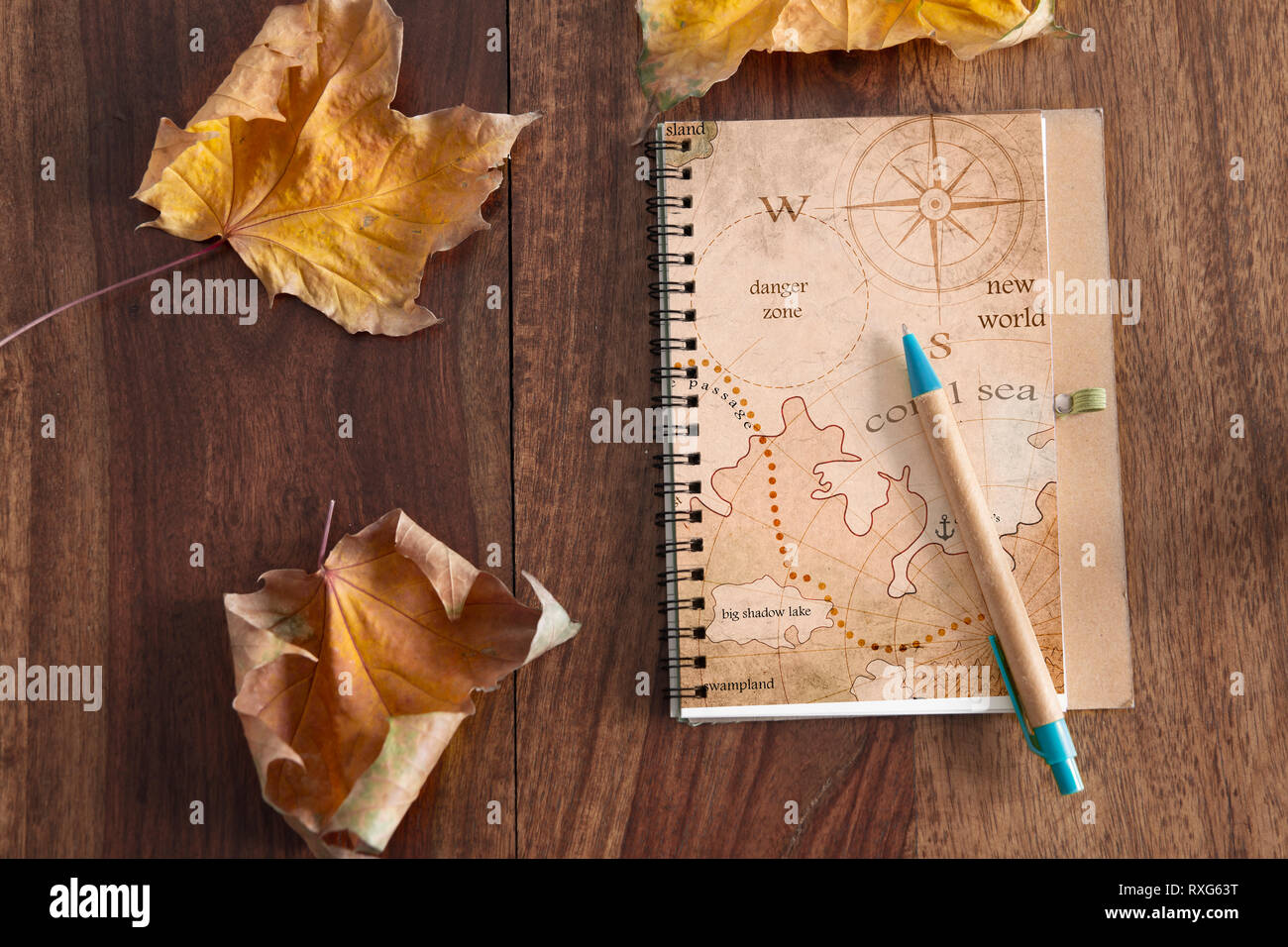 travel journal on wood table Stock Photo