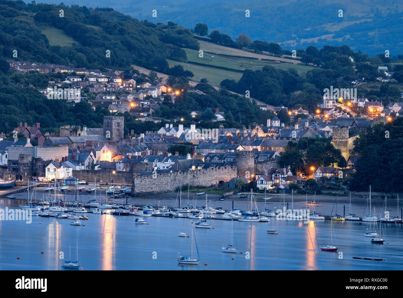 The Town of Conwy at night viewed across the Conwy Estuary, North Wales, UK Stock Photo
