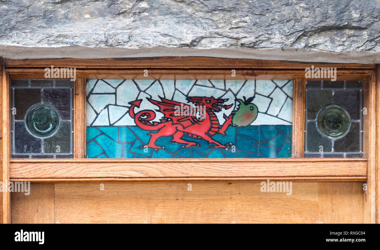 Welsh Dragon glass insert in front door, Bedgellert Village, Snowdonia National Park, North Wales, UK Stock Photo