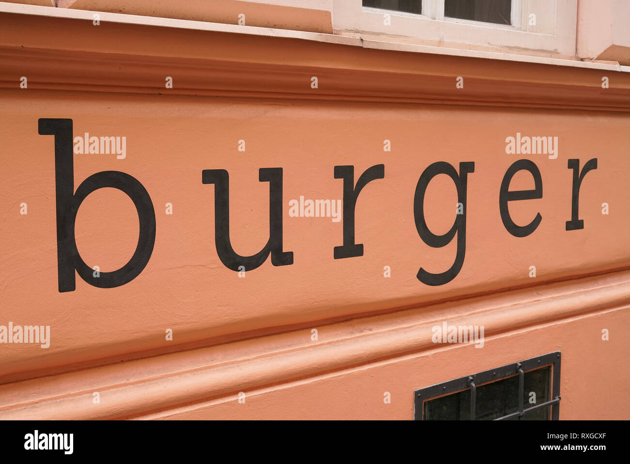 Lettering on the facade of a house in Prague with the word 'burger' Stock Photo