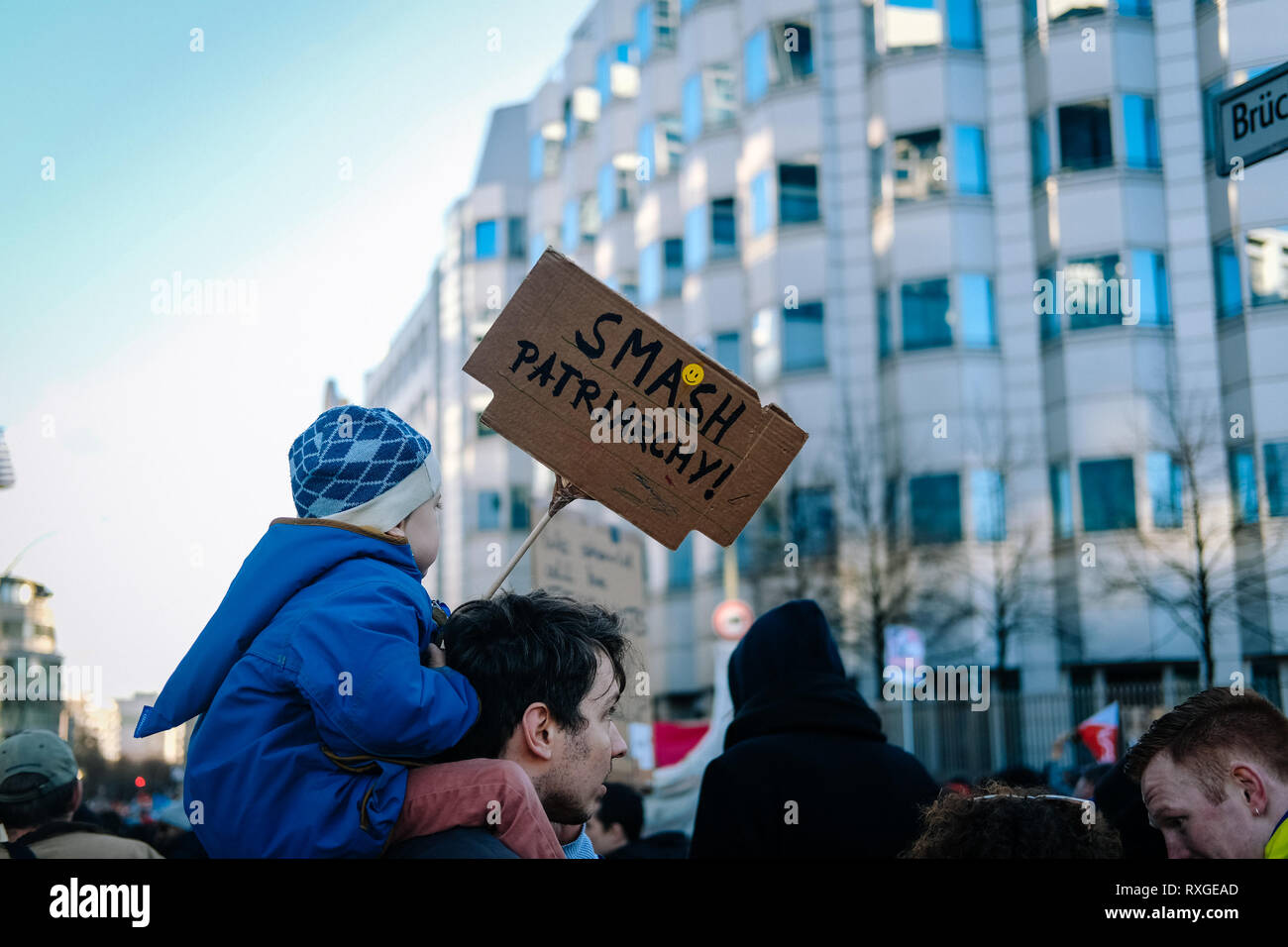 A kid seen holding a placard saying smash patriarchy during the protest. Thousands of people celebrate the international women´s day with protests demanding for women rights in berlin. Stock Photo