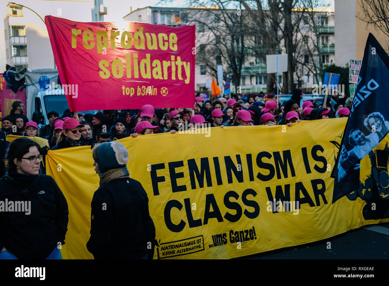 Protesters are seen holding banners during the protest. Thousands of people celebrate the international women´s day with protests demanding for women rights in berlin. Stock Photo