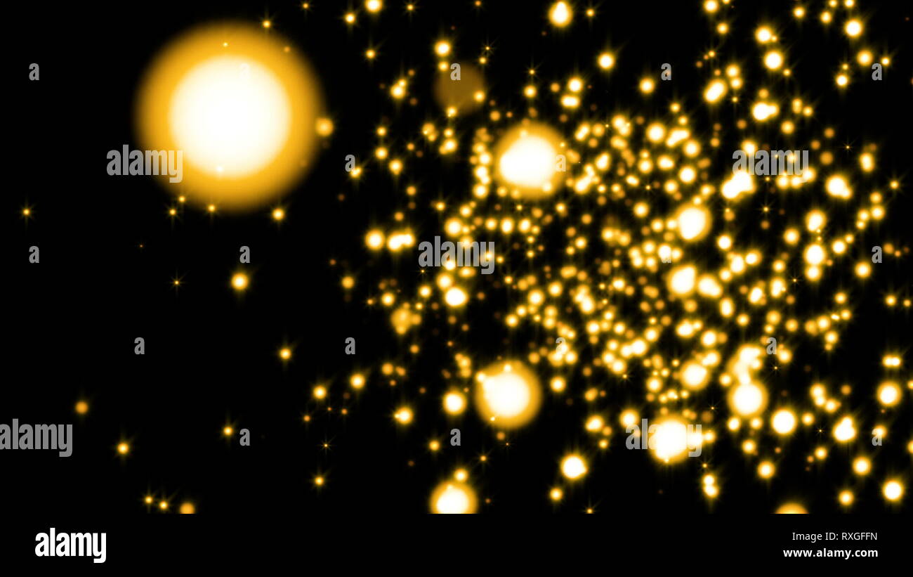 Glittering particles sparkle and drift along on a soft current. Gold particles Stock Photo