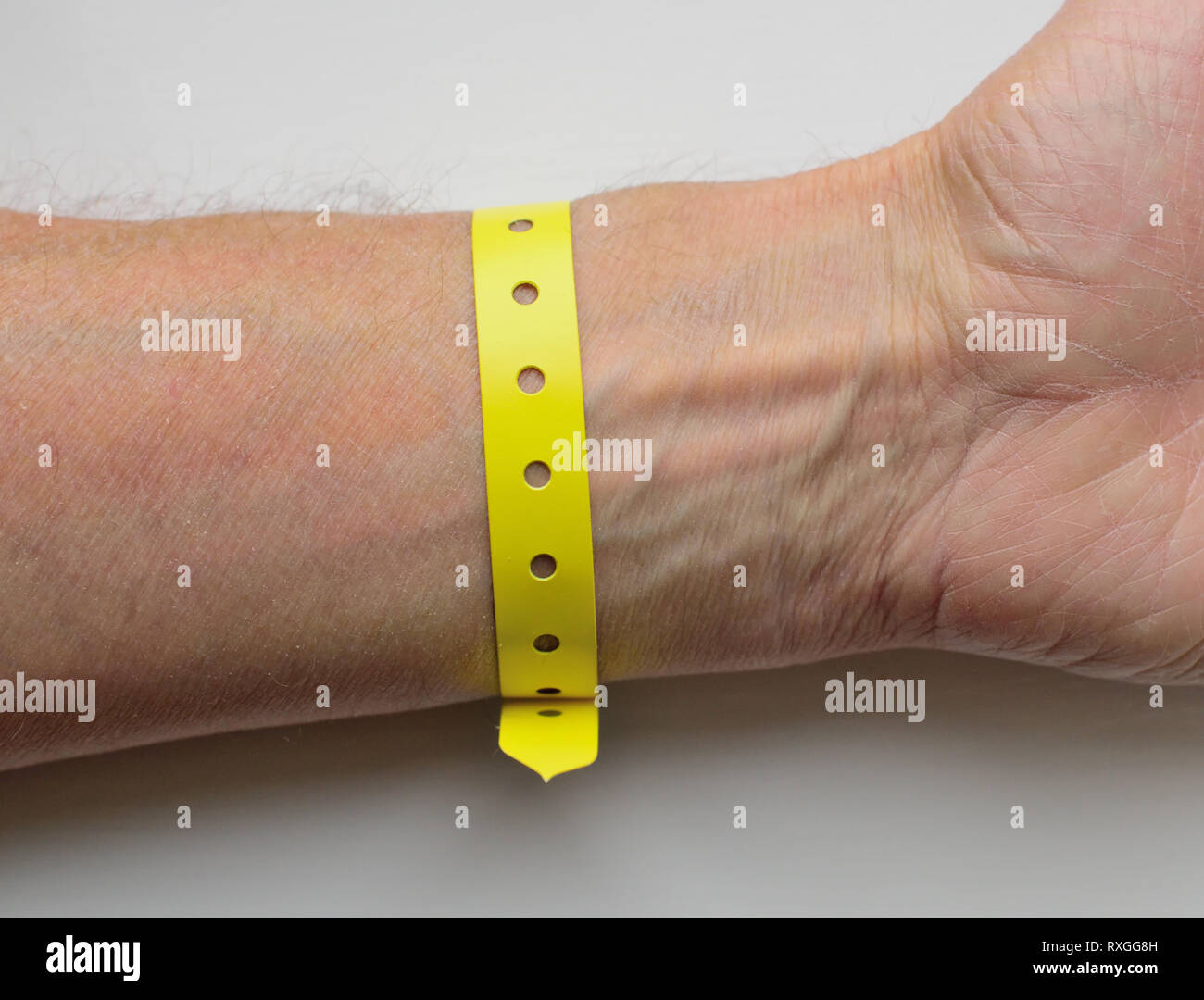 A plastic wristband worn by a hospital patient. Stock Photo