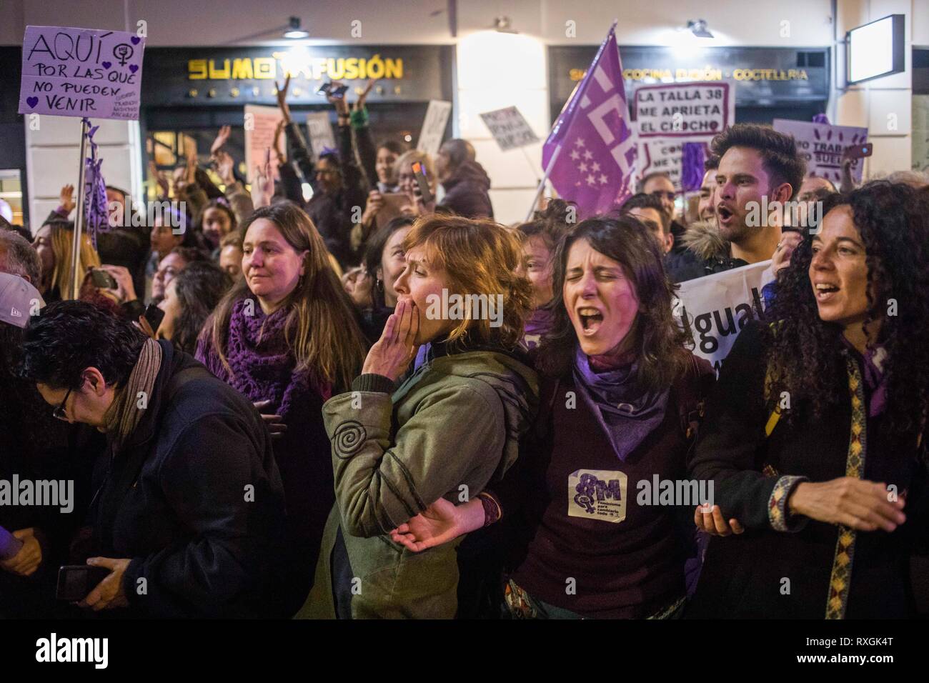 Protesters are seen shouting slogans during the demonstration. Feminist protest demanding for women rights during the International Women's Day in Madrid. According to the authorities, the estimation of more than 350,000 people have participated in the protest. Stock Photo