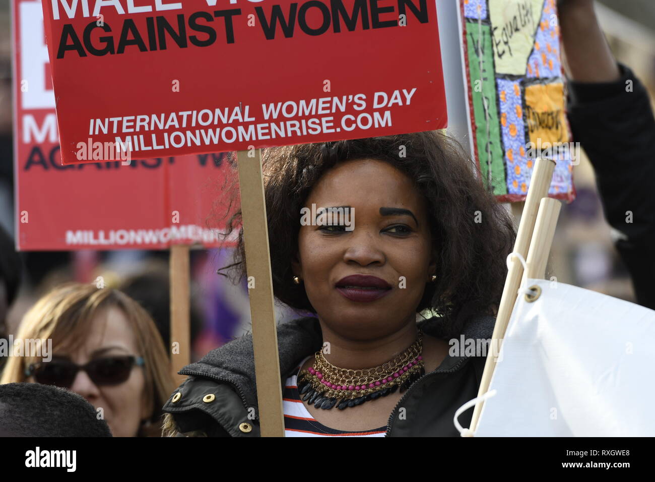 London, Greater London, UK. 9th Mar, 2019. A woman seen holding a placard during the Million Women's Rise march in London.Thousands of women marched through central London to a rally in Trafalgar Square in London demanding freedom and justice and the end of male violence against them. ''˜Never Forgotten' was the theme for this year's march and participants commemorated the lives of girls and women who have been killed by mens's violence. Credit: Andres Pantoja/SOPA Images/ZUMA Wire/Alamy Live News Stock Photo