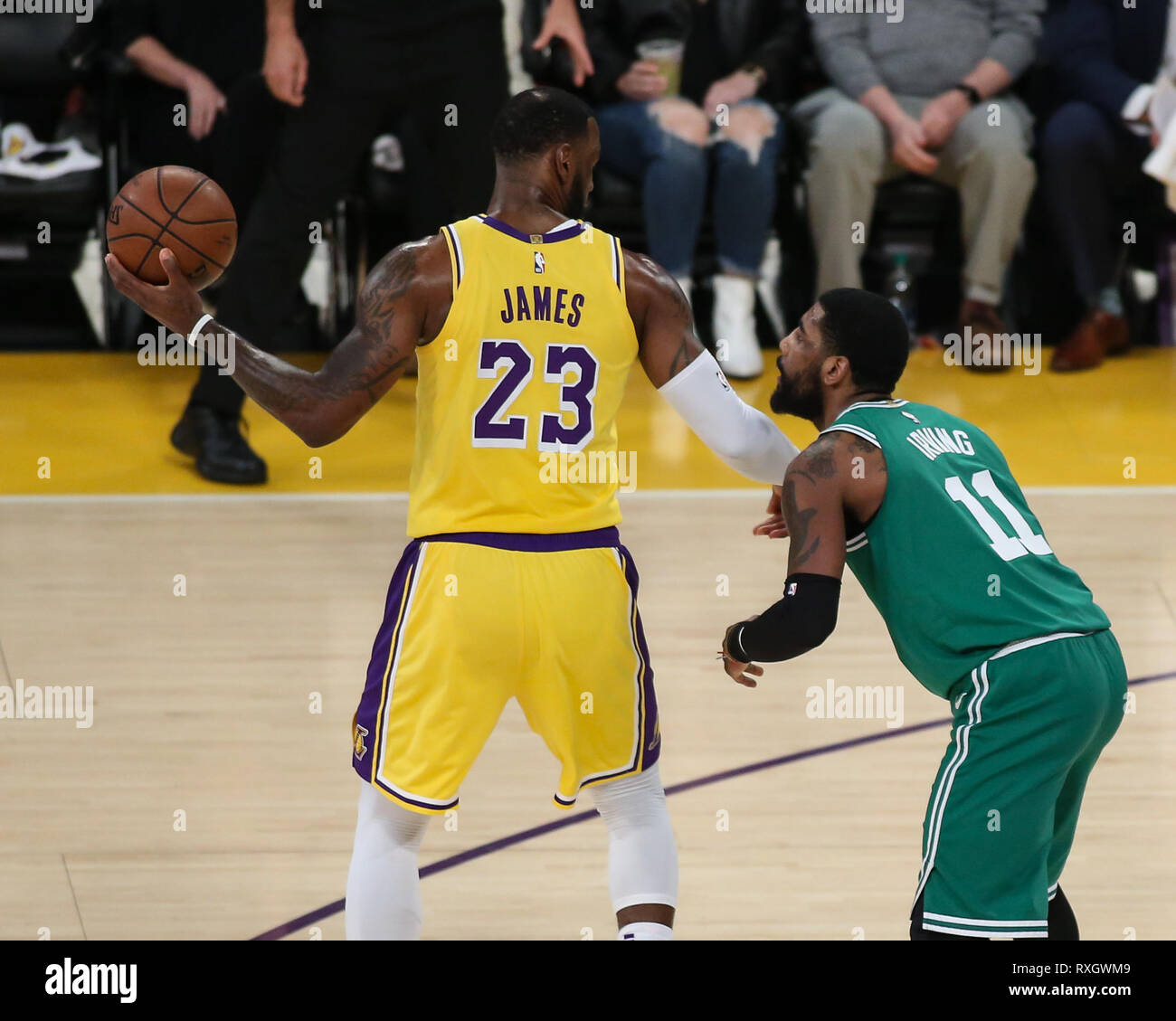 Los Angeles Lakers forward LeBron James #23 being guarded by Boston Celtics guard Kyrie Irving #11 during the Boston Celtics vs Los Angeles Lakers game at Staples Center in Los Angeles, CA on March 09, 2019. (Photo by Jevone Moore) Stock Photo