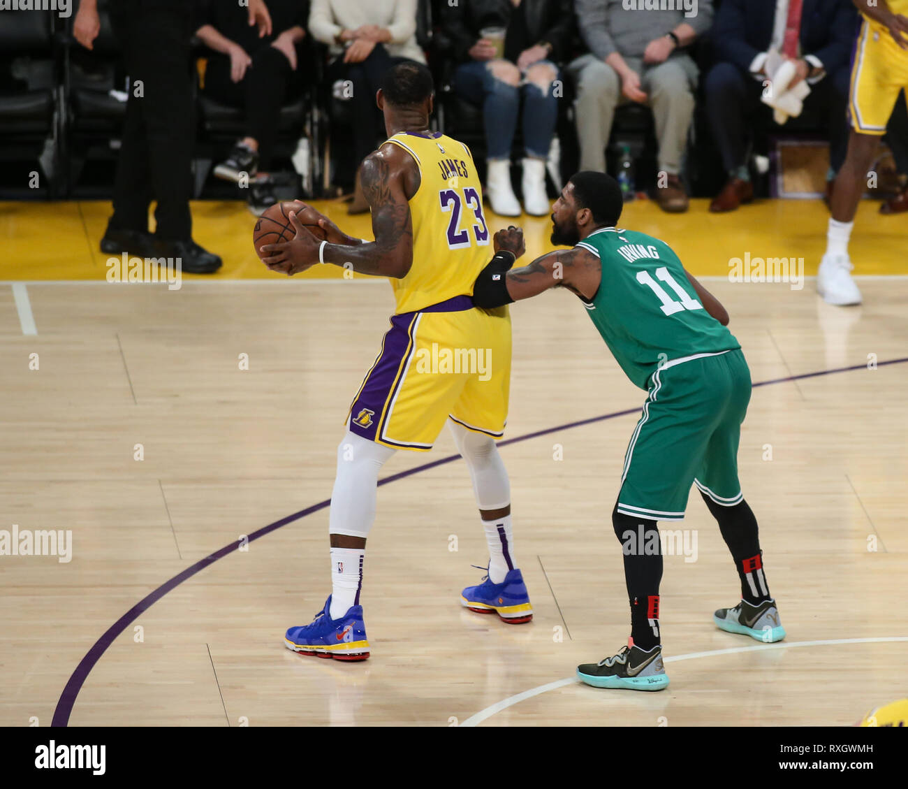 Los Angeles Lakers forward LeBron James #23 being guarded by Boston Celtics guard Kyrie Irving #11 during the Boston Celtics vs Los Angeles Lakers game at Staples Center in Los Angeles, CA on March 09, 2019. (Photo by Jevone Moore) Stock Photo
