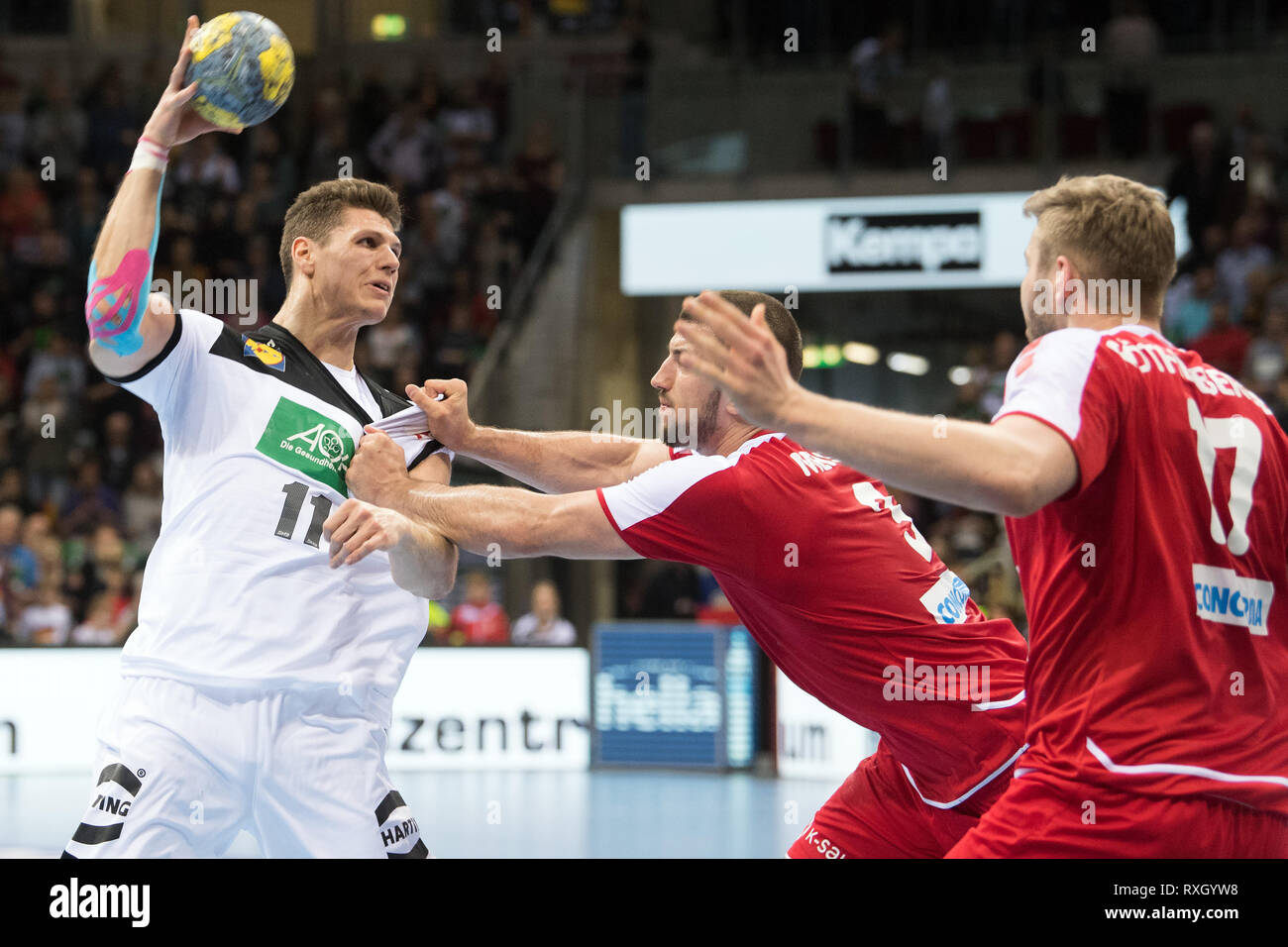 Dusseldorf, Germany. 9th March 2019. Handball: International match, Germany - Switzerland in the ISS Dome. Germany's Sebastian Heymann and Switzerland's Lucas Meister fight for the ball. Photo: Federico Gambarini/dpa Credit: dpa picture alliance/Alamy Live News Stock Photo
