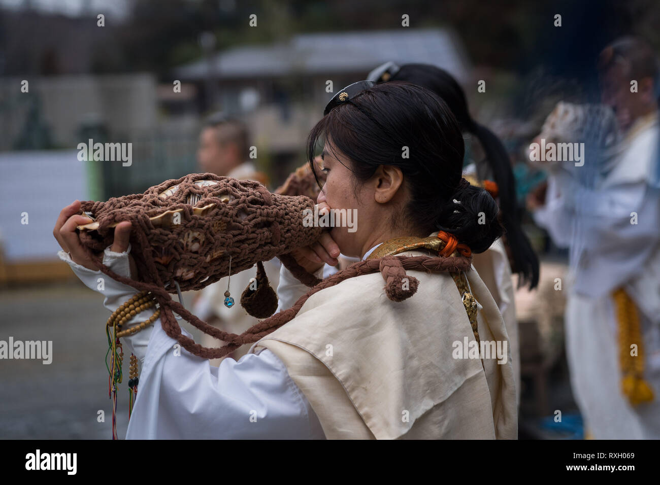 Tokyo, Japan. 10th March 2019. 'Yamabushi' blows in a conch shell horns during a fire walking ceremony (Hiwatari-sai festival in Japanese) which heralds the coming of spring, at Yakuoin Temple on Mt. Takao in the city of Hachioji in western Tokyo, 10 March 2019. Credit: Nicolas Datiche/AFLO/Alamy Live News Credit: Aflo Co. Ltd./Alamy Live News Stock Photo