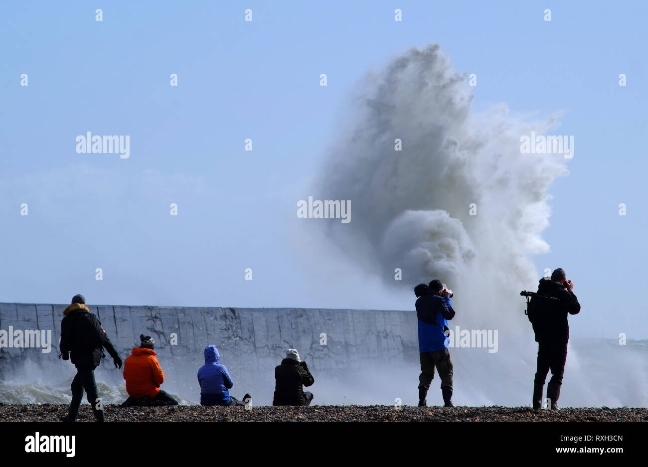 Newhaven, East Sussex, UK. 10th March 2019. Massive waves smash into the cast iron lighthouse at Newhaven, East Sussex, as gale force winds whip the South coast. © Peter Cripps/Alamy Live News Stock Photo