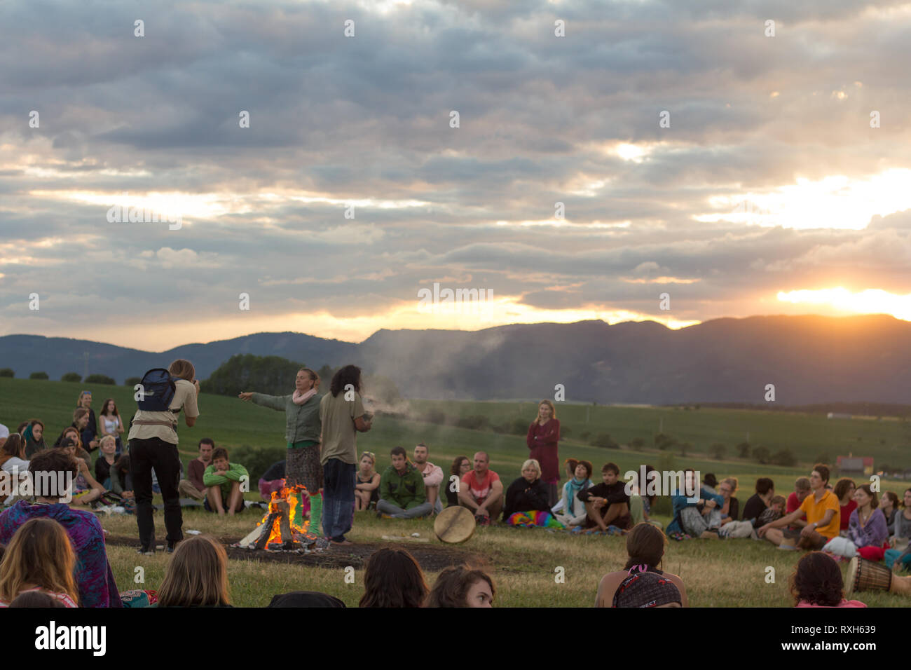 Drienok, Slovakia - June 2017: group of people sitting in nature enjoying sunset in Drienok, Slovakia Stock Photo