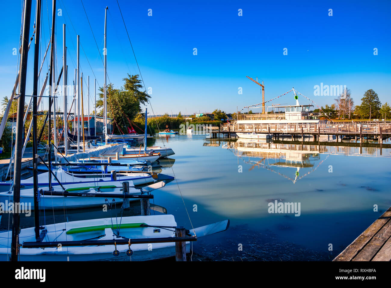 Austria, Neusiedl, 09/12/2018: Small harbour at Lake Neusiedl in Austria with Boats and sailing ships. Stock Photo