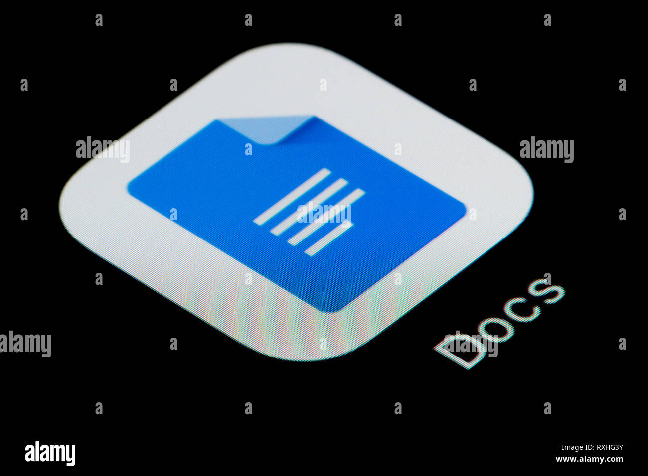A close-up shot of the Google Docs app icon, as seen on the screen of a smart phone (Editorial use only) Stock Photo