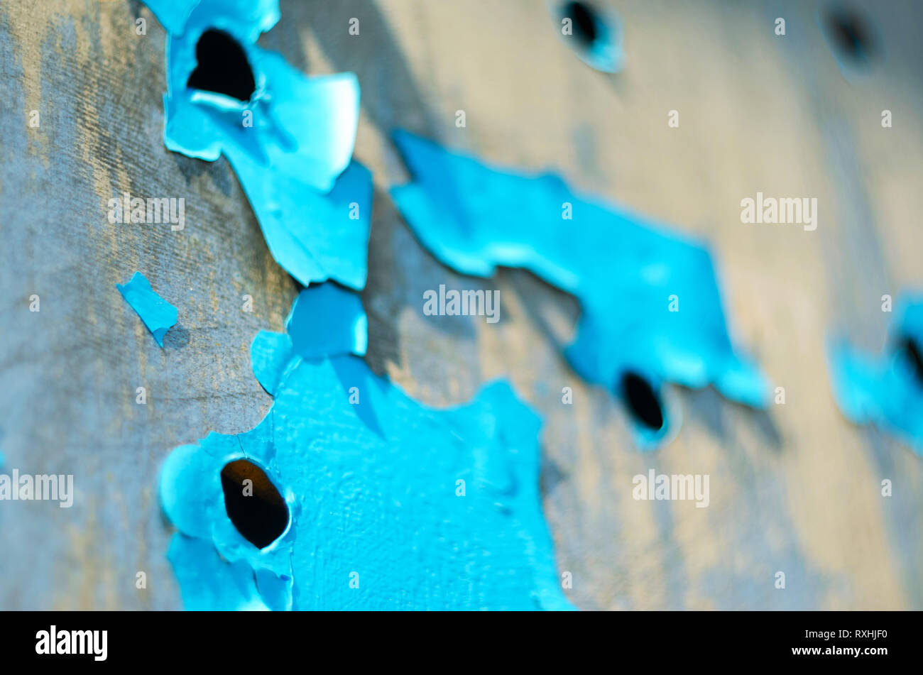 Perforated Steel Sheet with Peeling Blue Paint. Abstract Background of Aged Material Stock Photo