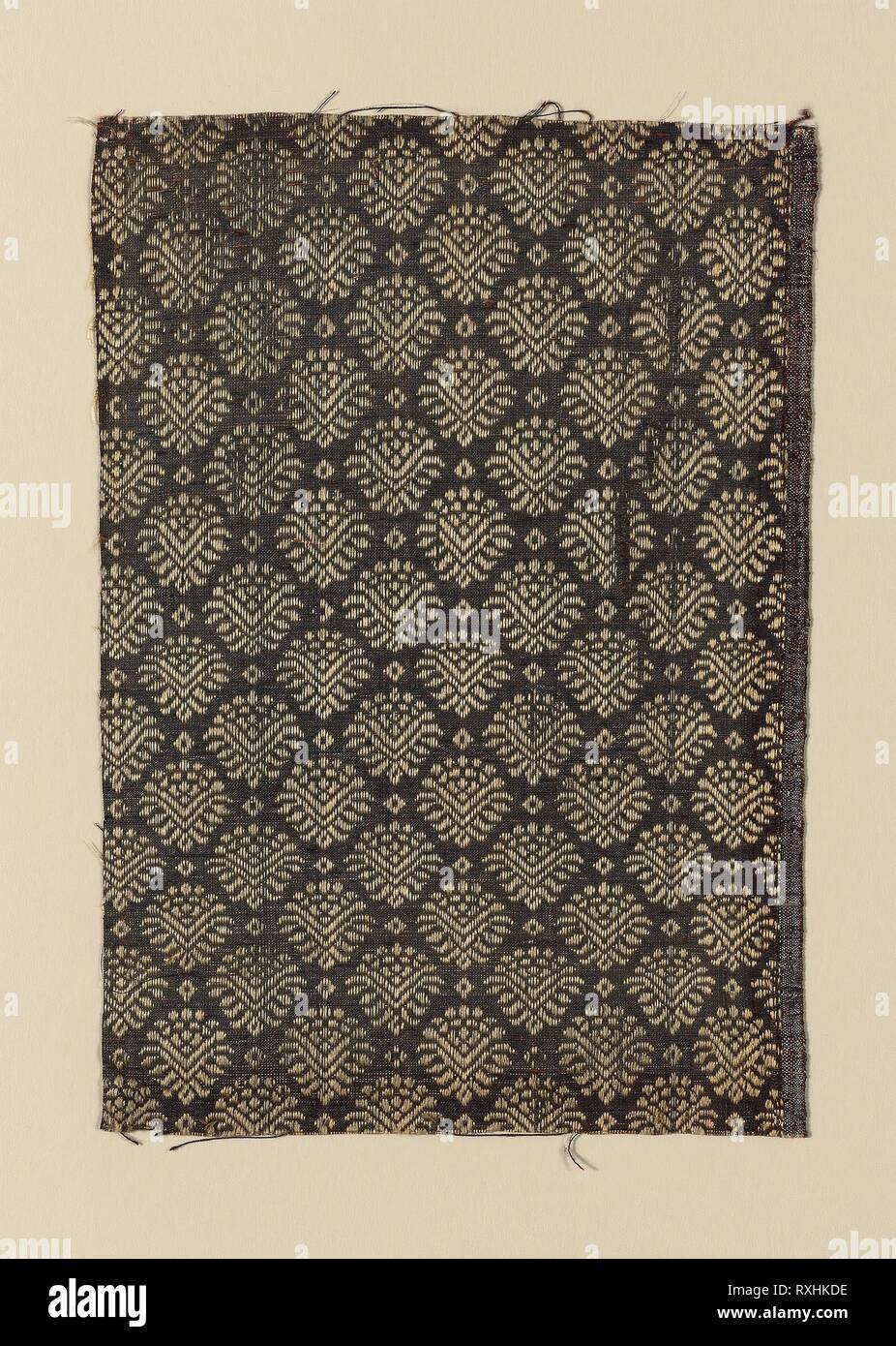 Fragment. Italy. Date: 1650-1700. Dimensions: 25.7 x 18.3 cm (10 1/8 x 7 1/4 in.). Silk, plain weave with supplementary patterning warps tied by supplementary binding wefts. Origin: Italy. Museum: The Chicago Art Institute. Stock Photo