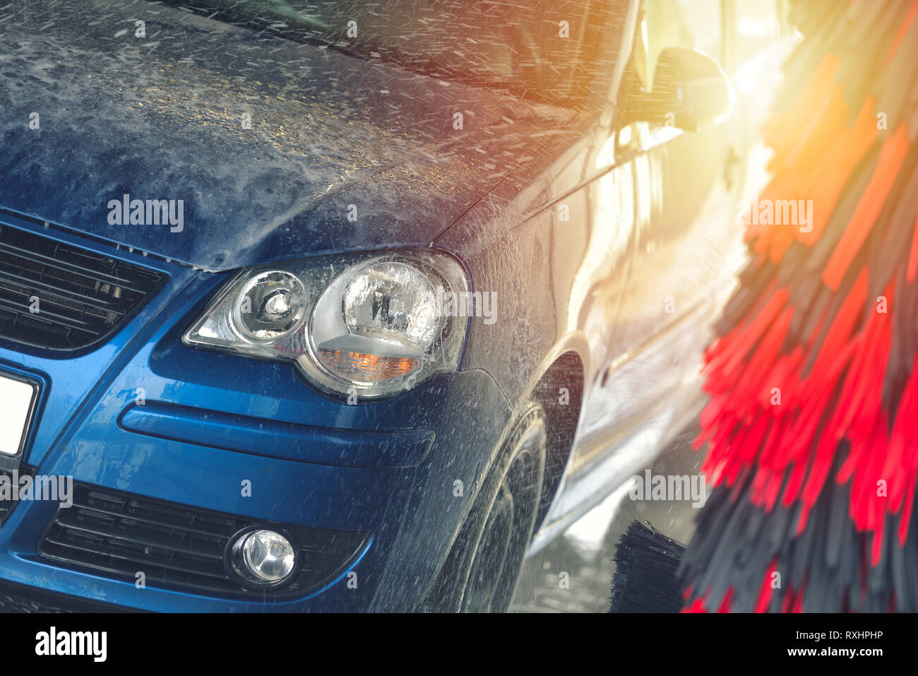 Red compact SUV car with sport and modern design washing with soap. Car  covered with white foam. Car care service business concept. Car wash with  foam Stock Photo - Alamy