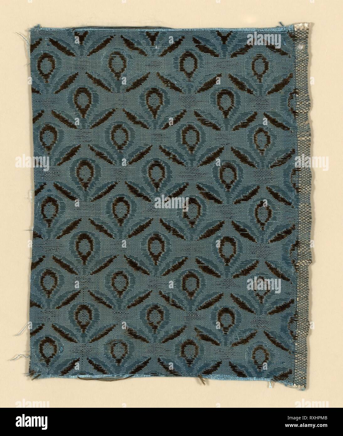 Fragment. Spain. Date: 1775-1800. Dimensions: 14 x 10.6 cm (5 1/2 x 4 3/16 in.)  Repeat: 2.9 x 2.6 cm (1 1/8 x 1 in.). Silk and silvered-metal strip, warp-faced weft-ribbed plain weave with supplementary patterning wefts. Origin: Spain. Museum: The Chicago Art Institute. Stock Photo