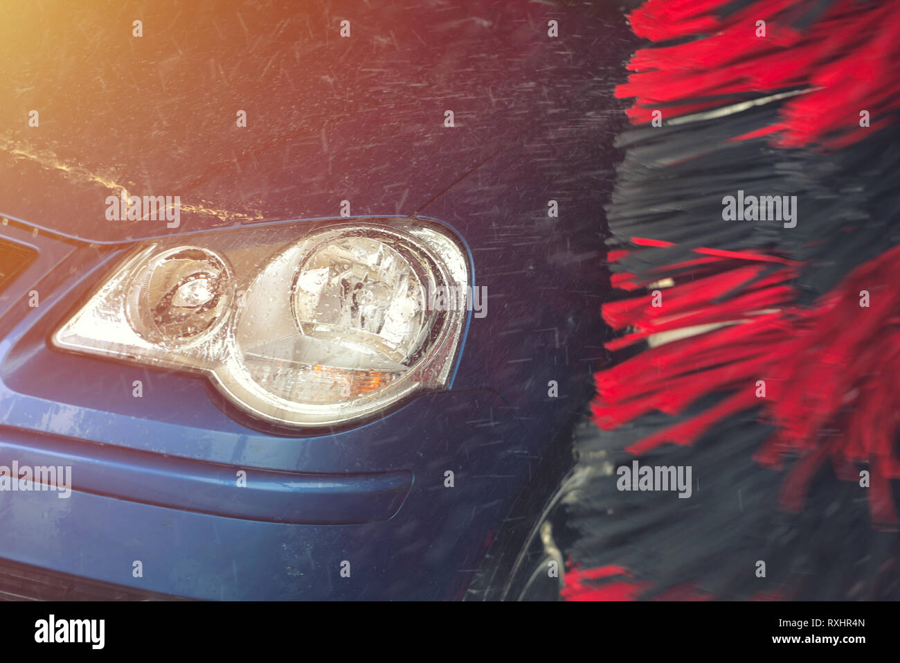 Automatic car wash in action. Car wash concept. Automated technology