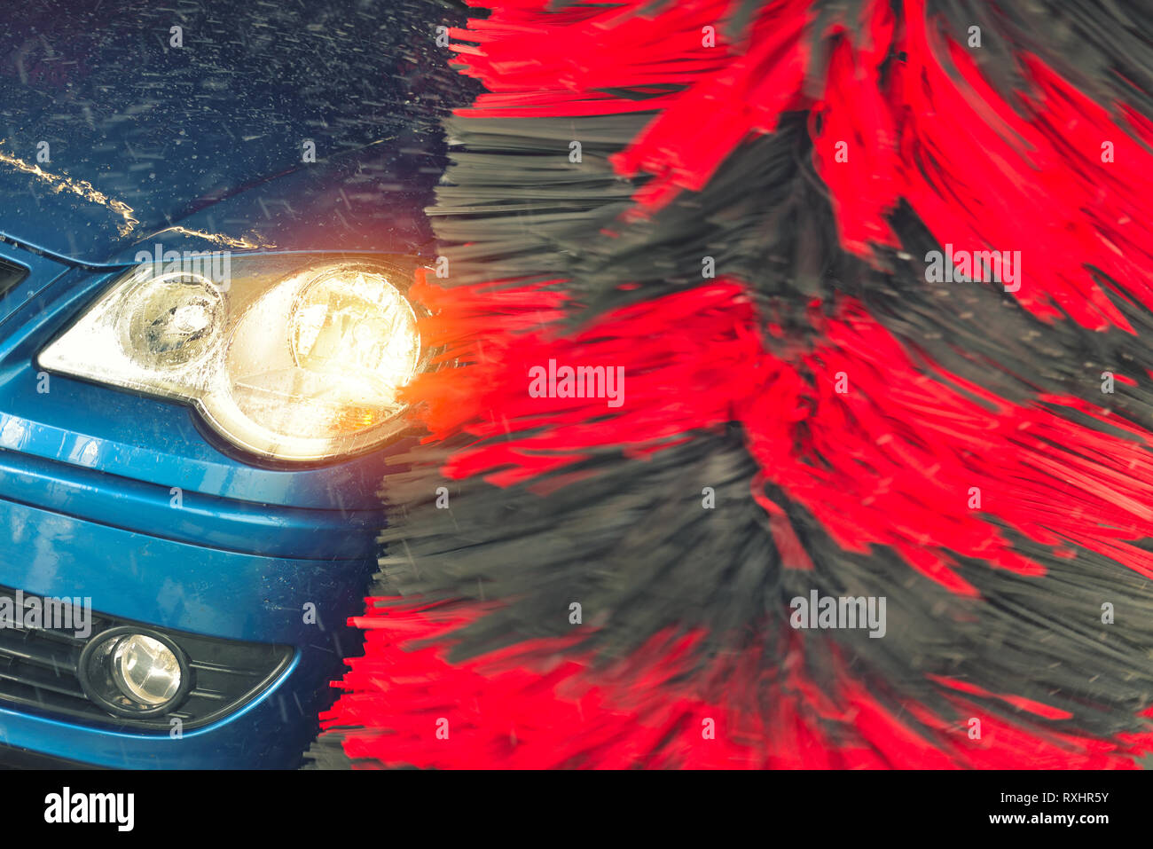 Automatic car wash in action. Car wash concept. Automated technology ...