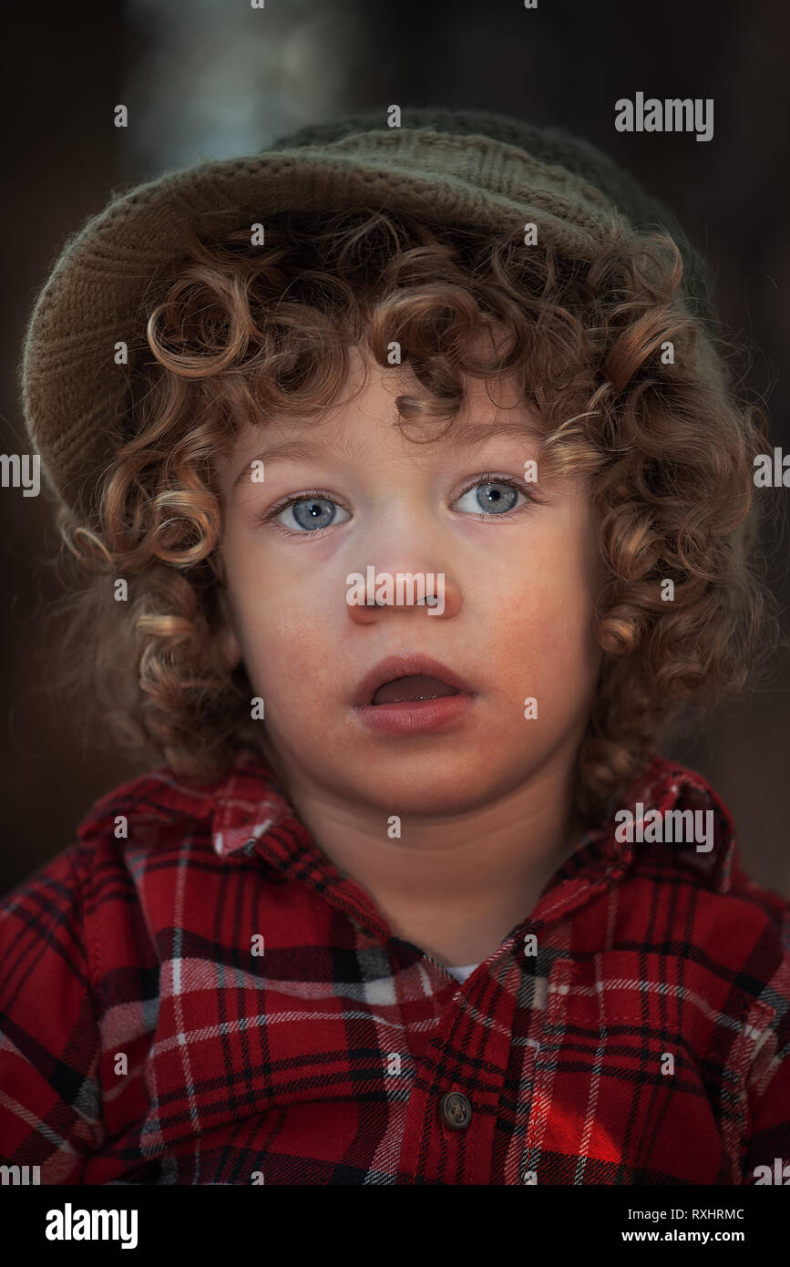 Curly hair cute 3 years old kid Stock Photo