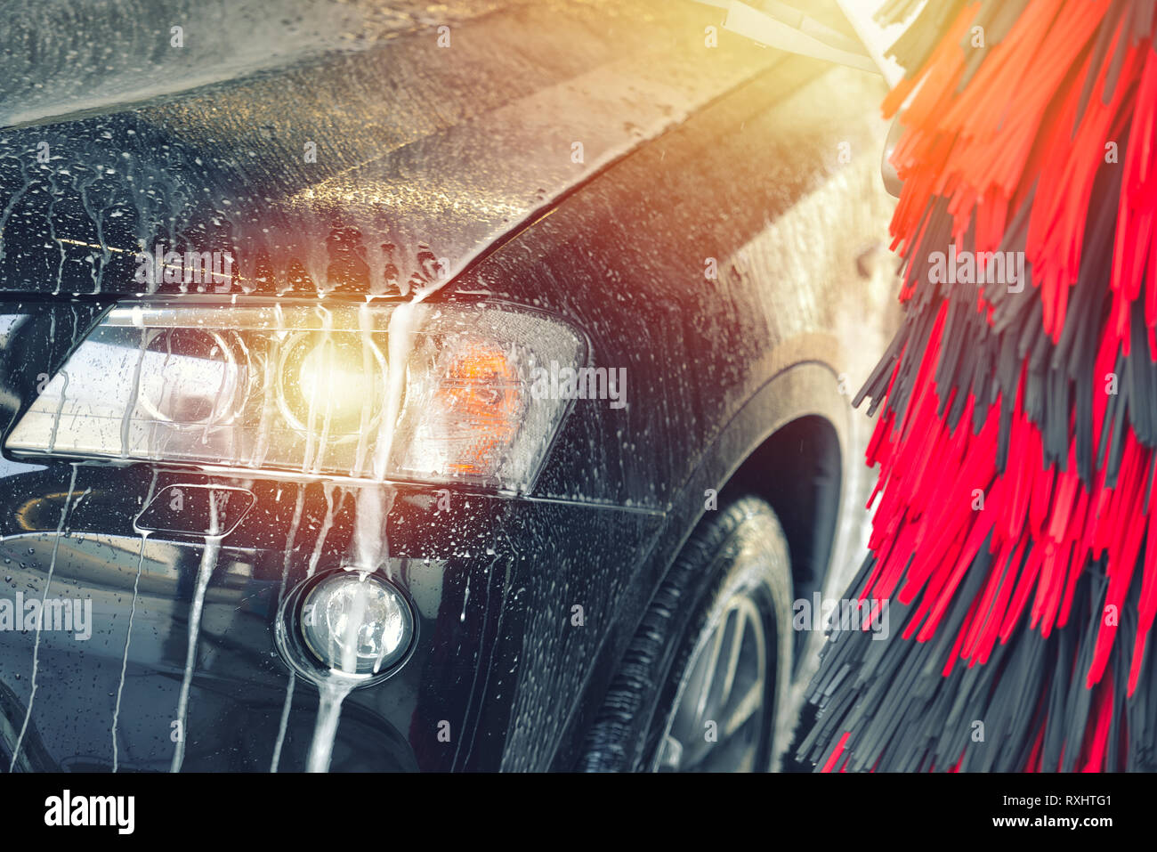 Automatic car wash in action. Car wash concept. Automated technology