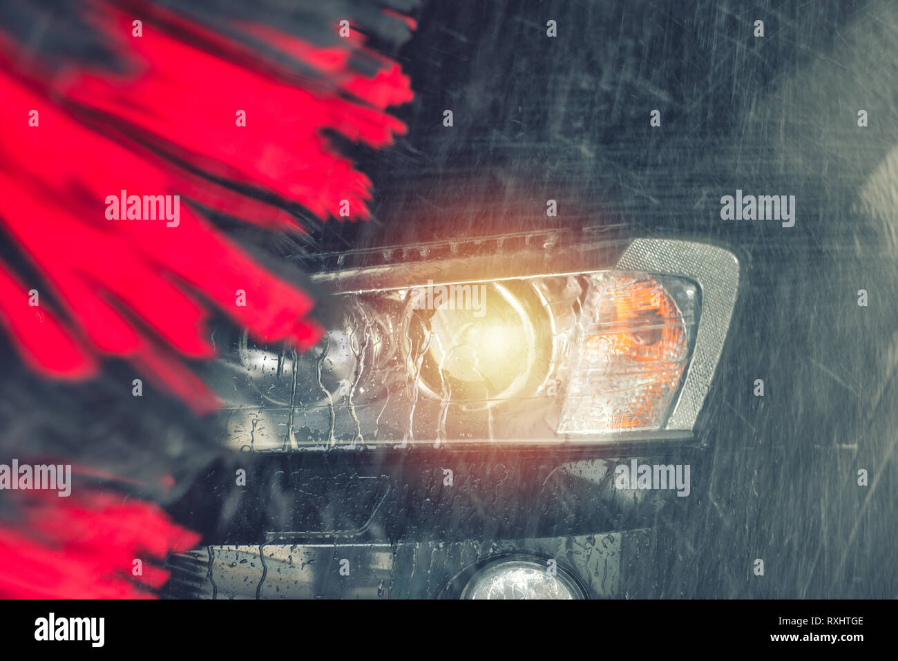 Automatic car wash in action. Car wash concept. Automated technology ...
