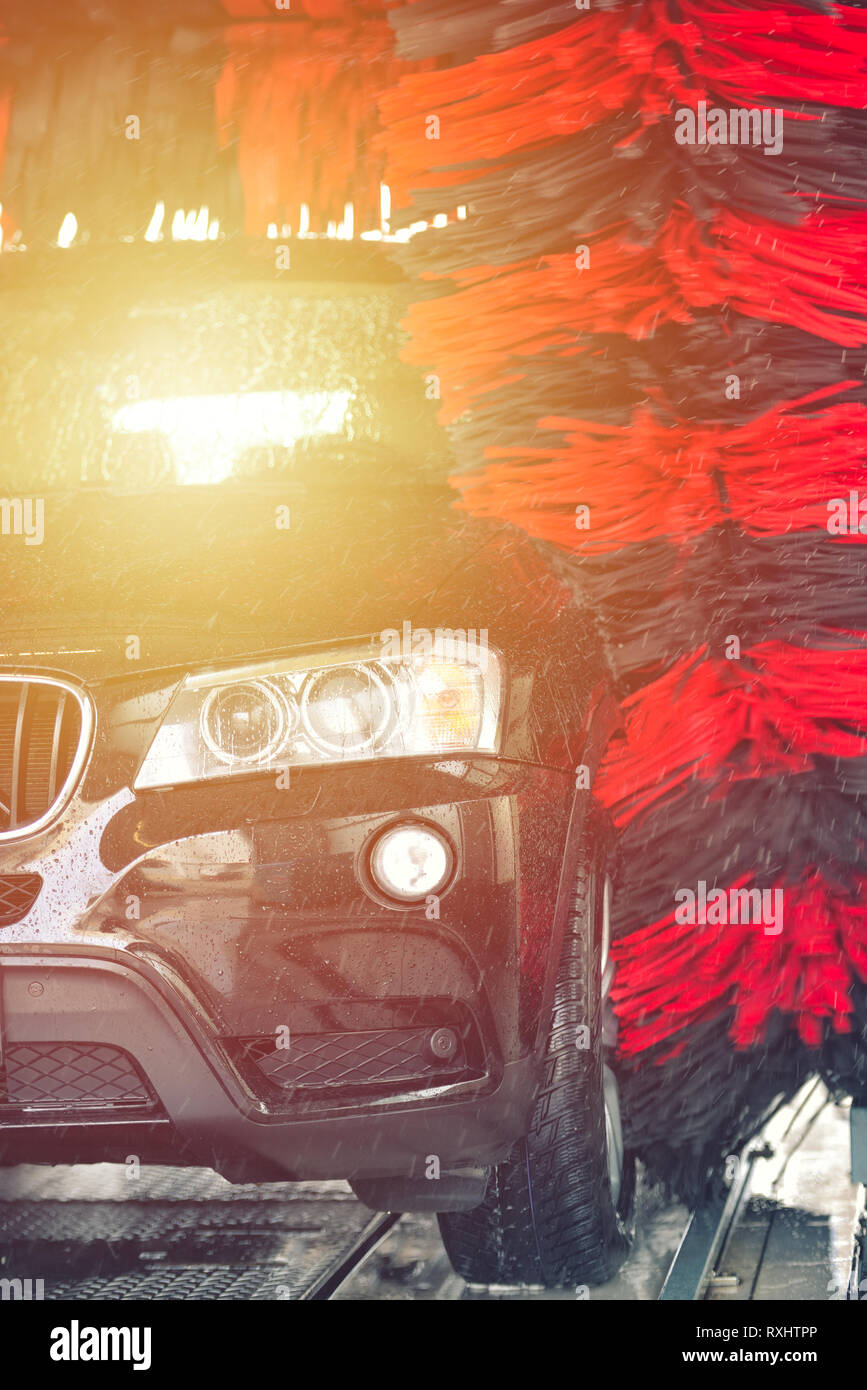 Automatic car wash in action. Car wash concept. Automated technology