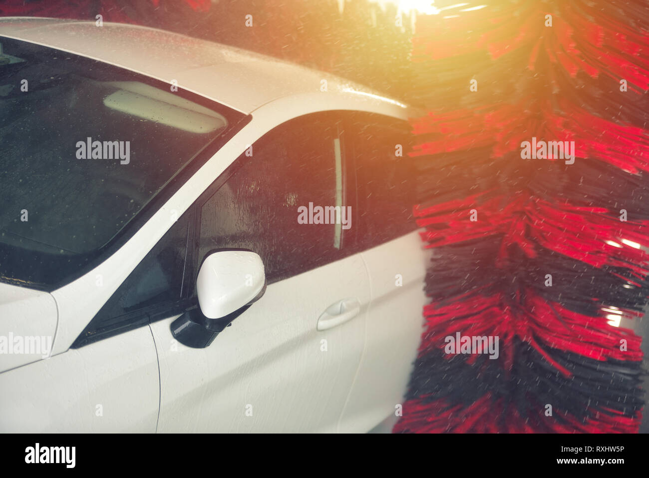 Automatic car wash in action. Car wash concept. Automated technology