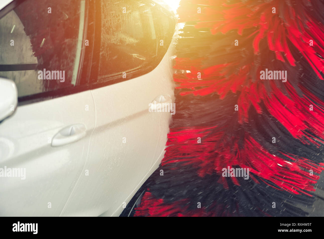 Automatic car wash in action. Car wash concept. Automated technology