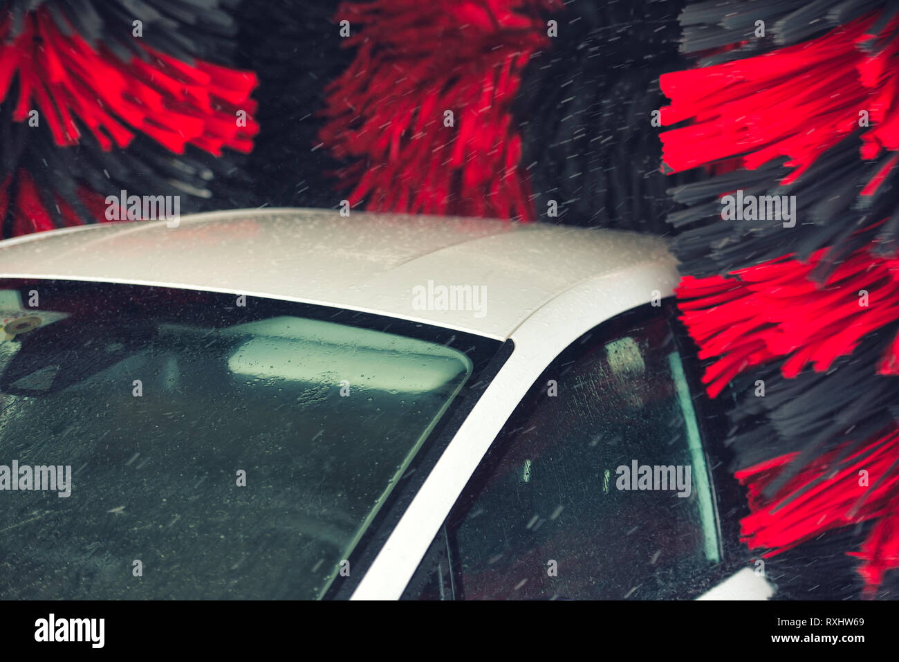 Automatic car wash in action. Car wash concept. Automated technology