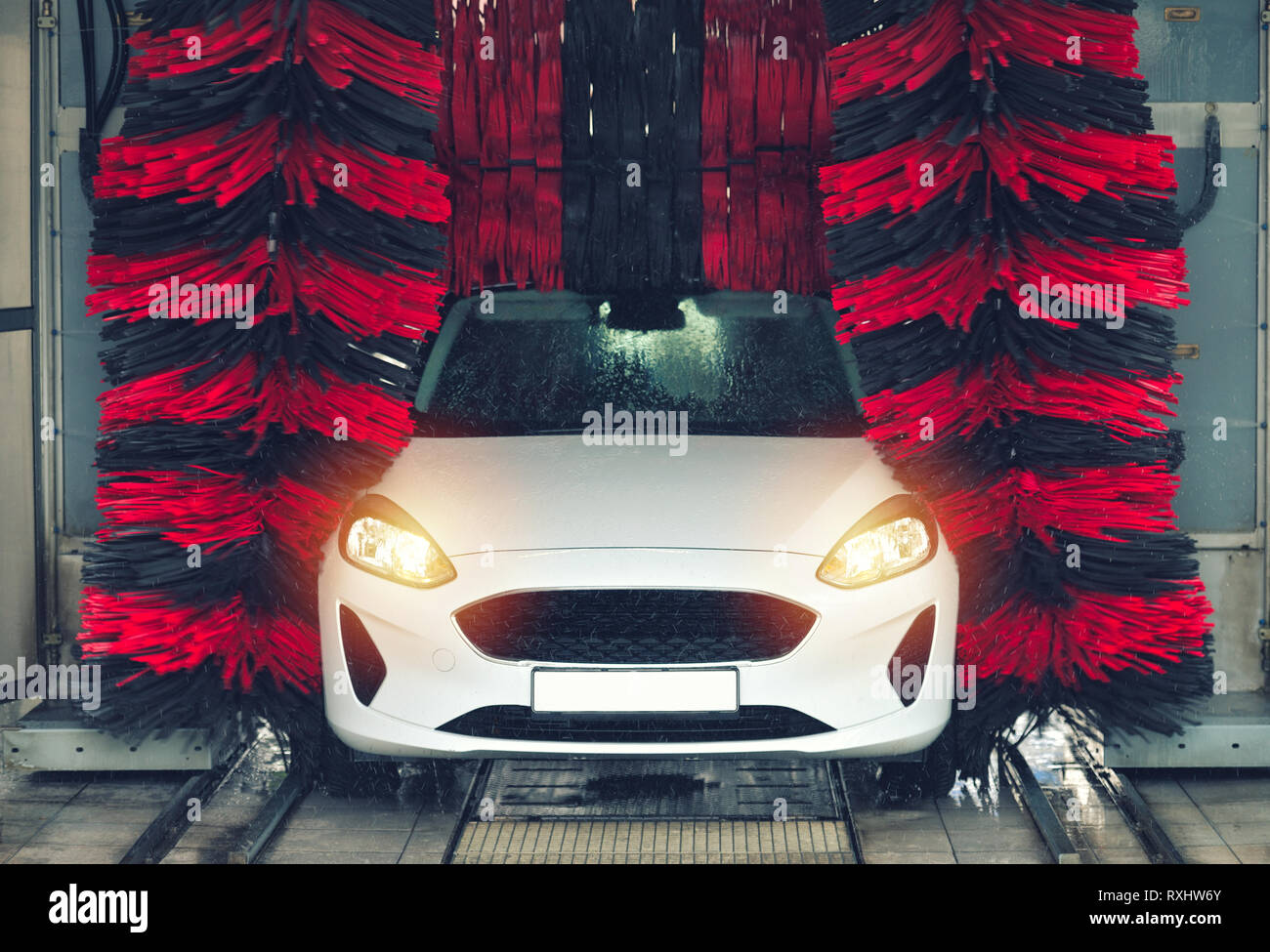 Automatic car wash in action. Car wash concept. Automated technology