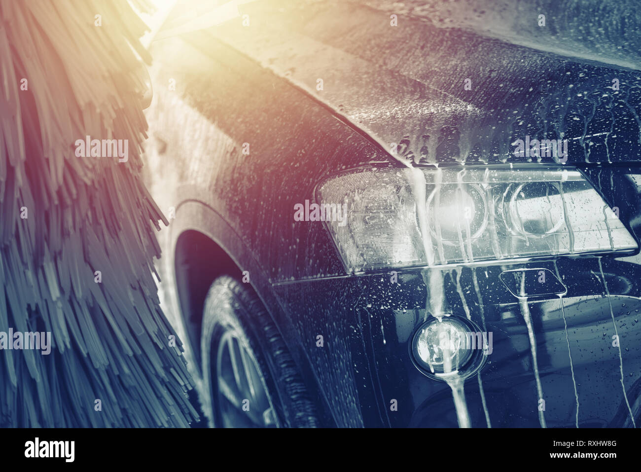 Automatic car wash in action. Car wash concept. Automated technology