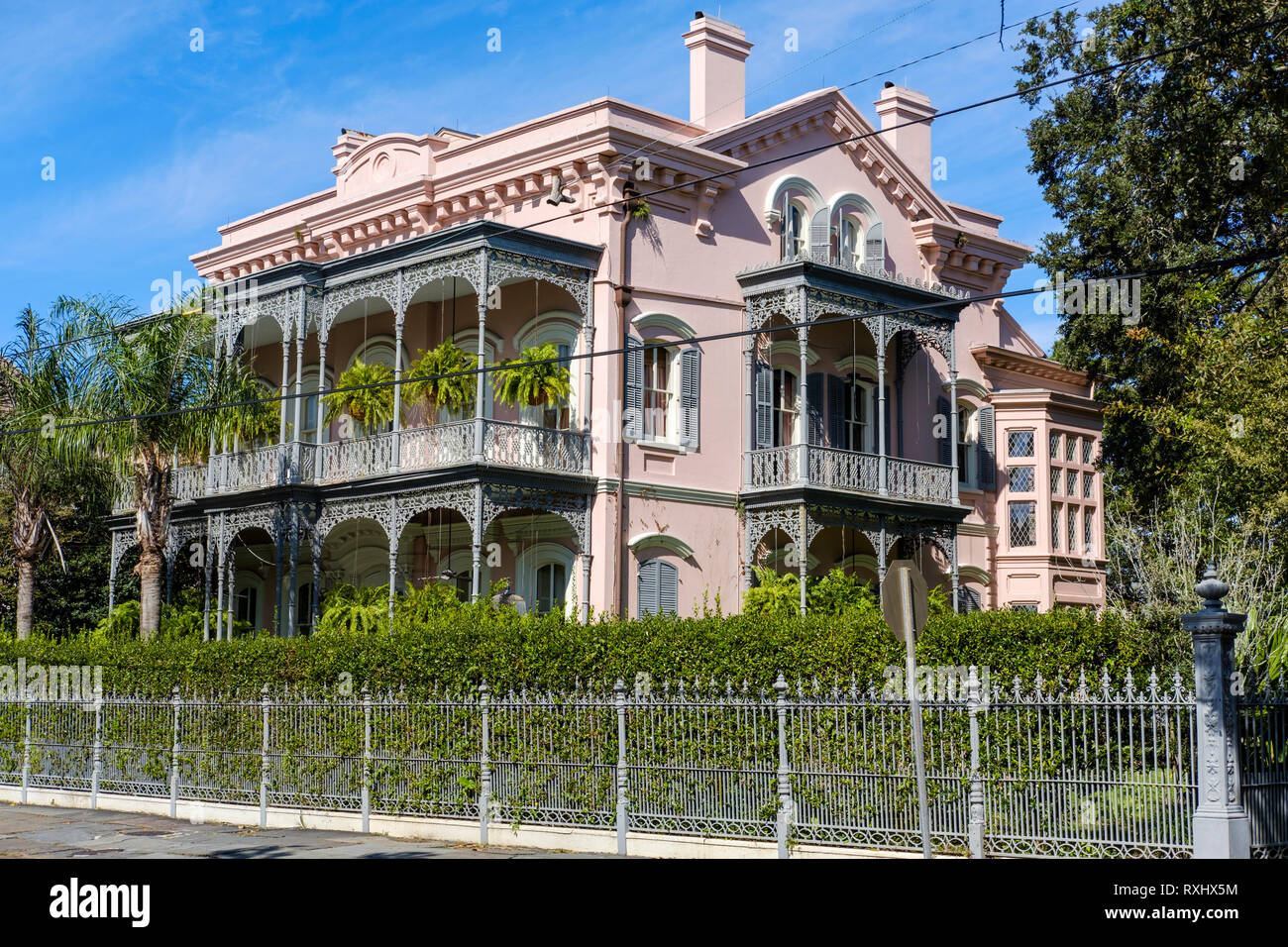 The ornate facade of Carroll-Crawford House, three-story Italianate house, cast-iron balconies and fence, Garden District, NOLA, New Orleans, USA. Stock Photo