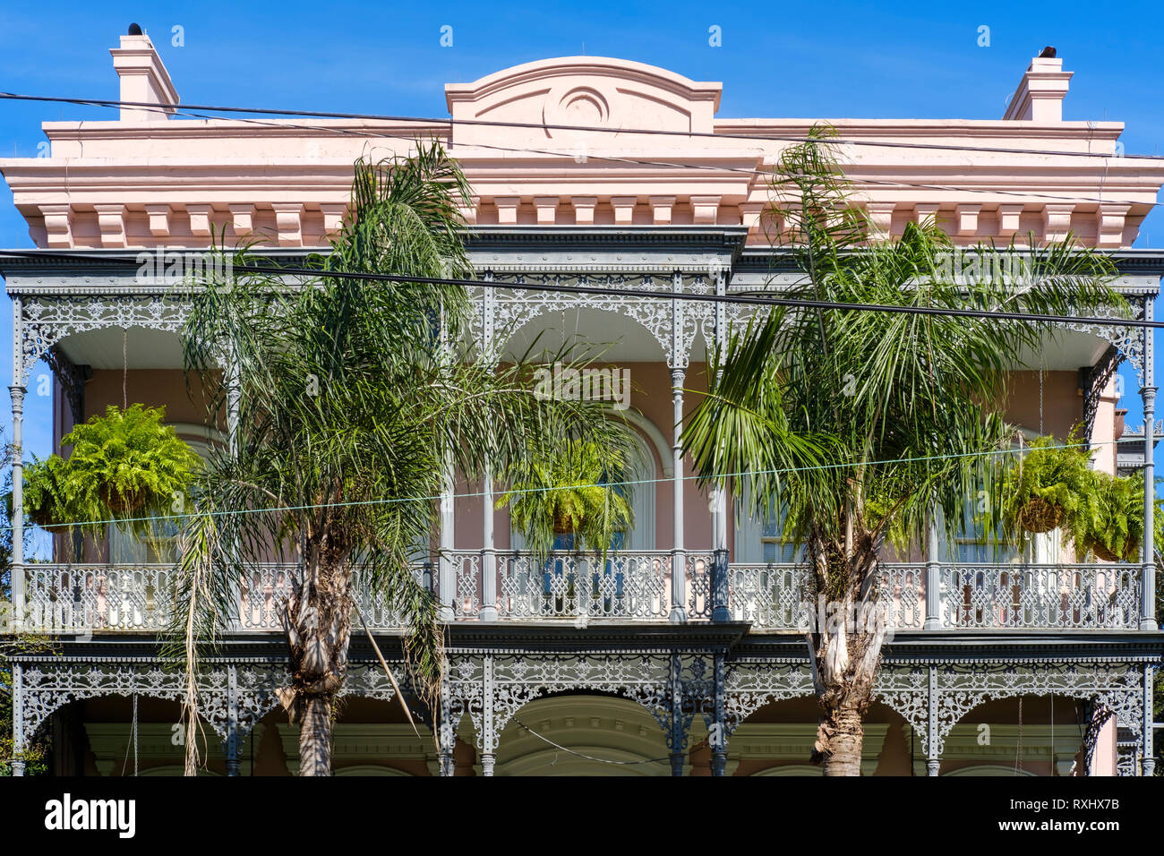 Ornate facade, Carroll-Crawford House, three-story Italianate colonial house, cast-iron balconies and fence, Garden District, NOLA, New Orleans, USA. Stock Photo